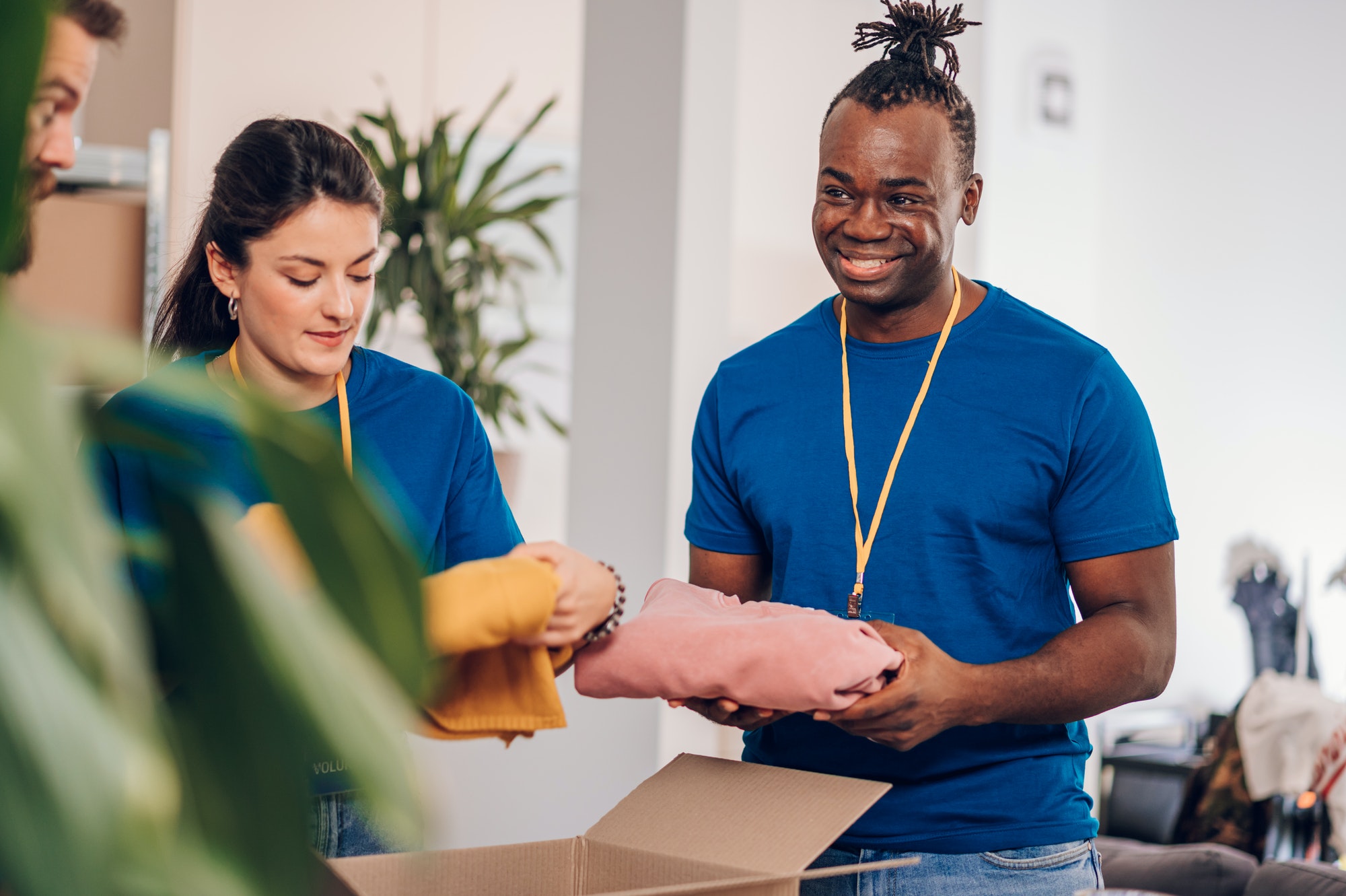 African american male volunteer working in a charity donation center